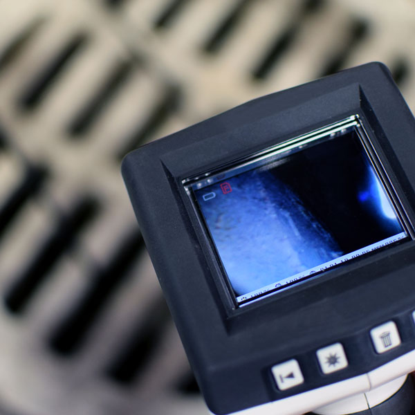 camera inspecting sewer pipe